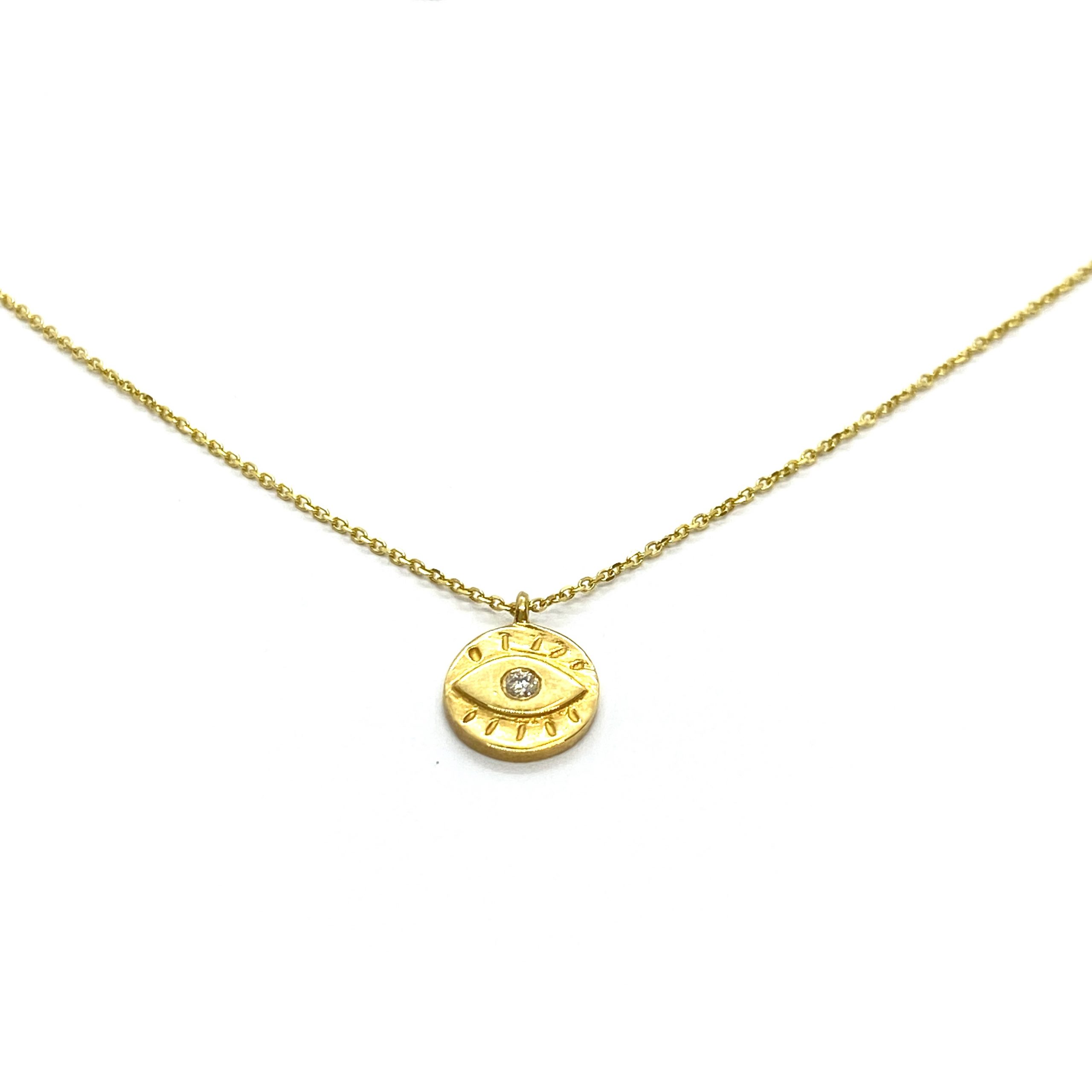 Small golden eye pendant — Melina Fachidis